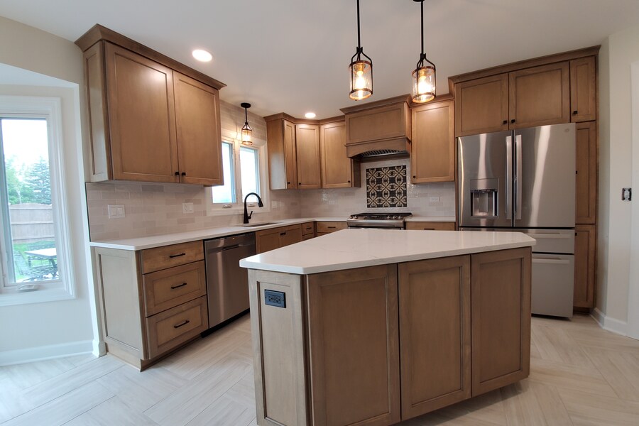 After: warm maple shaker kitchen with decorative patterned tile and island