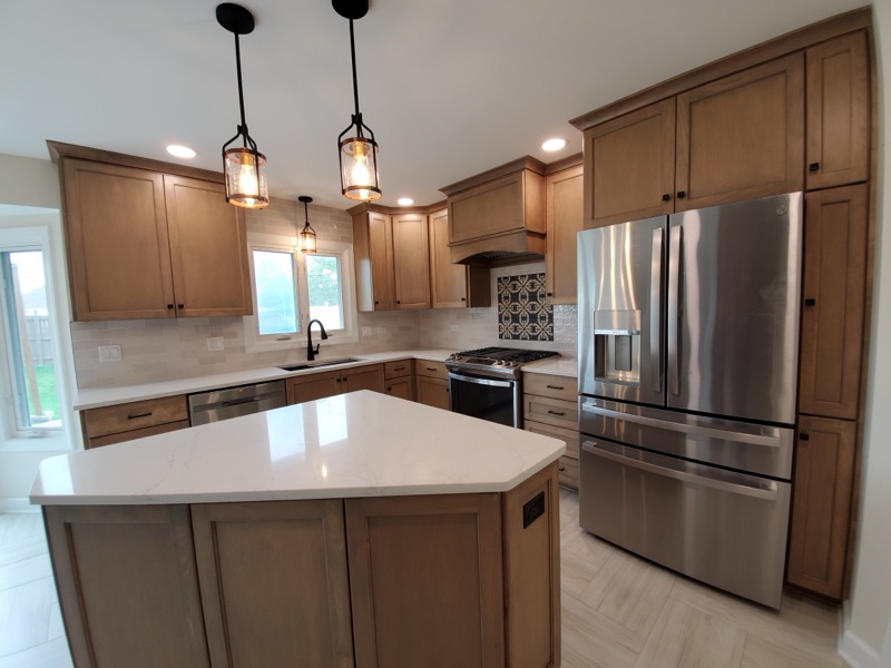 Open concept kitchen renovation with stainless steel appliances in Chicagoland