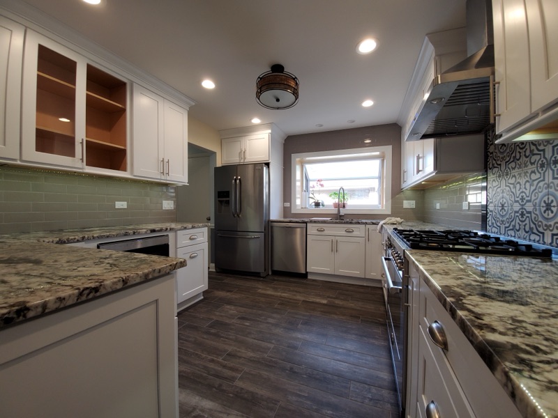 Luxury kitchen backsplash tile work and under-cabinet lighting installation